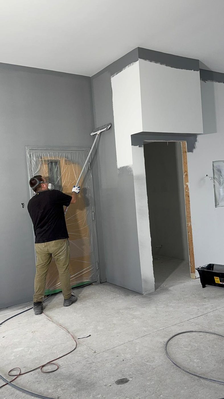Rolling a fresh coat onto interior walls