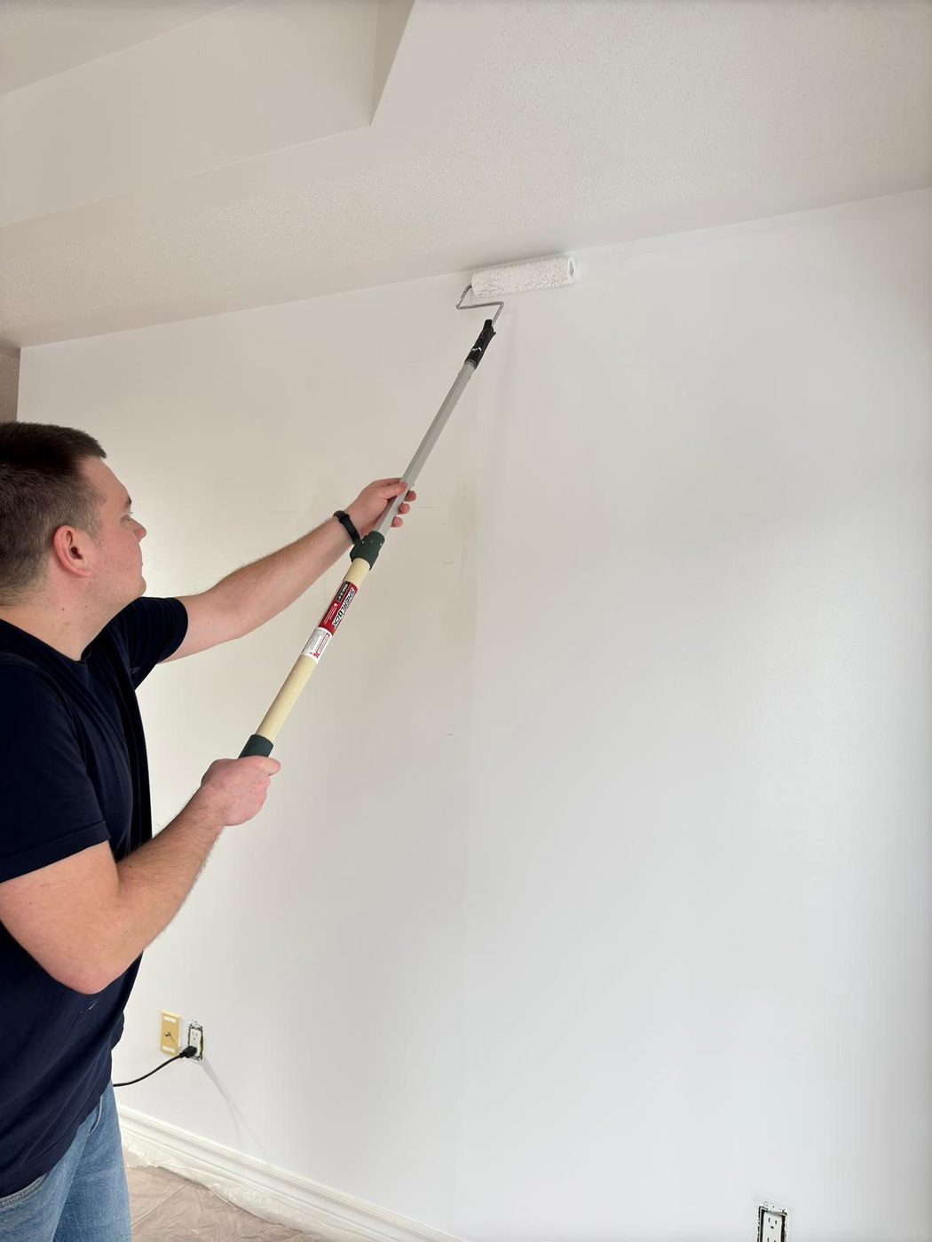 Rolling a ceiling with an extension pole